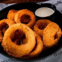 Onion Rings · Battered and Deep Fried Onion Rings Served with House Made Ranch.