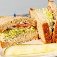 Tuna Salad · Mayo, mustard, Freshly cut lettuce, tomatoes and red onions on your choice of white, whole w...