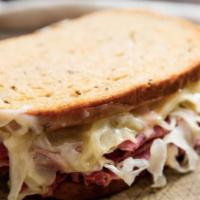 Reuben · Corned beef, sauerkraut, swiss cheese and thousand island dressing on toasted Rye Bread.