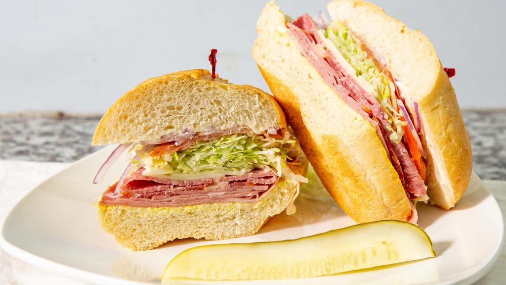 Torpedo · Mayo, mustard, Italian salami, mortadella, spicy capicola, provolone cheese, Italian dressing, freshly cut lettuce, tomatoes and red onions on French Roll bread