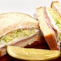 Deli Deluxe · Mayo, mustard, roast beef, turkey, ham, freshly cut lettuce, tomatoes and red onions on your...