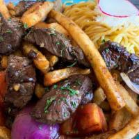 Lomo Saltado Shaken Fries · The best-seller here in our store !! Lomo saltado shaken fries always has our marinated beef...