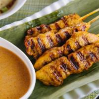 Chicken Satays · Marinated chicken breast grilled on skewer. Served with a peanut sauce and a cucumber salad.