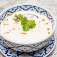 Tom Kha Soup ( Coconut Milk Soup ) · Regular spicy. Coconut milk soup with thai herbs, mushrooms, green onions and fresh lime jui...