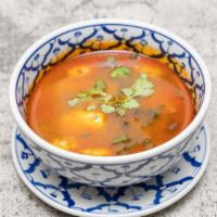 Tom Yum Soup ( Hot And Sour Soup ) · Regular spicy. Hot and sour soup with thai herbs, mushrooms, green onions and fresh lime jui...