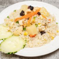 Pineapple Fried Rice · Wok fried rice with pineapple, curry powder, onion, egg and cashew.