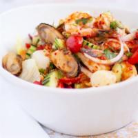 Seafood Salad · Spicy. Shrimp, calamari, scallop, and mussel with celery, onion, cucumber, mint, cilantro, a...