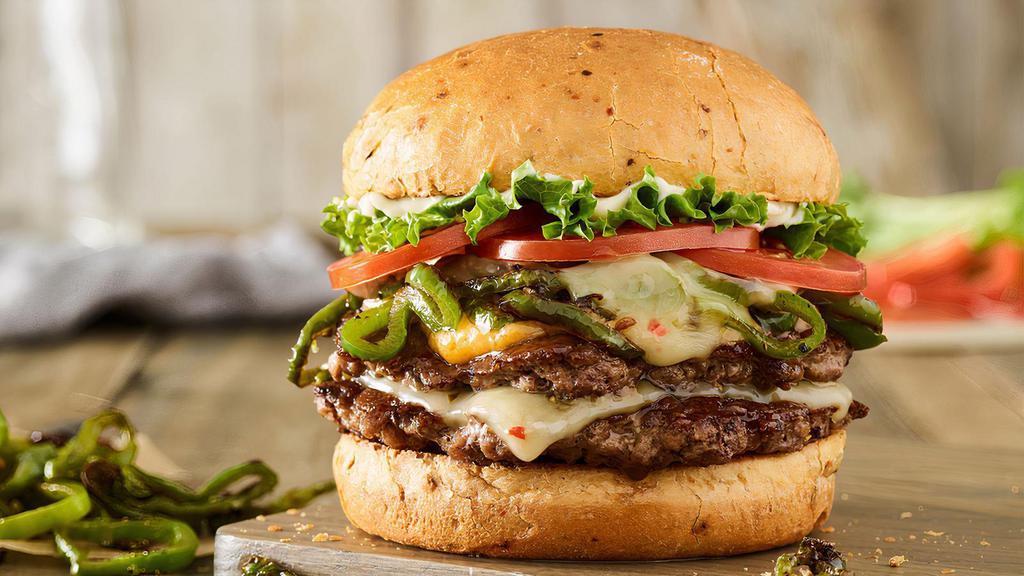 Colorado Double Smash Burger · Certified Angus Beef patties, pepperjack cheese, melted cheddar cheese, grilled chiles, lettuce, tomato, mayo, on a toasted spicy chipotle bun.