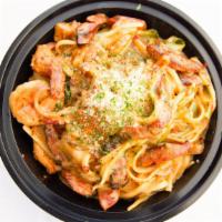Cajun Linguini · Chicken, shrimp , spicy sausage, bell peppers & onions in a creamy spicy Cajun sauce. Topped...