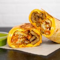 Sausage, Egg And Cheddar Burrito · 3 fresh cracked cage-free scrambled eggs, melted Cheddar cheese, breakfast sausage, crispy p...