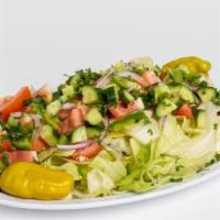 Moro'S Mediterranean Salad · Chopped lettuce, tomatoes, cucumbers, radishes, onions, parsley with toasted pita bread, lem...