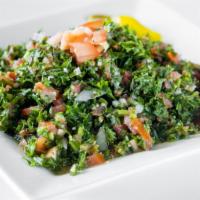 Tabouli · Chopped Italian parsley, tomatoes, onions, and bulgur tossed in lemon juice and olive oil.
