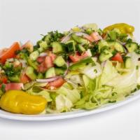 Green Salad · Chopped lettuce, tomatoes, and onions topped with Mediterranean dressing.