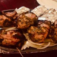 Chicken Tandoori · Grilled chicken marinated in yogurt and spices.