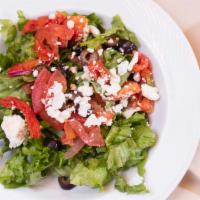 Mediterranean Salad · Sun dried and Roma tomatoes, olives, topped with Feta cheese and house dressing.