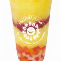 Sunny Mango Slush · Mango slush, mango, rainbow jelly, strawberry popping pearls, strawberry sauce.