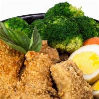 Crispy Fish Rice Bowl · Fried  fish over rice and minced pork. Accompanied by a tea egg, broccoli