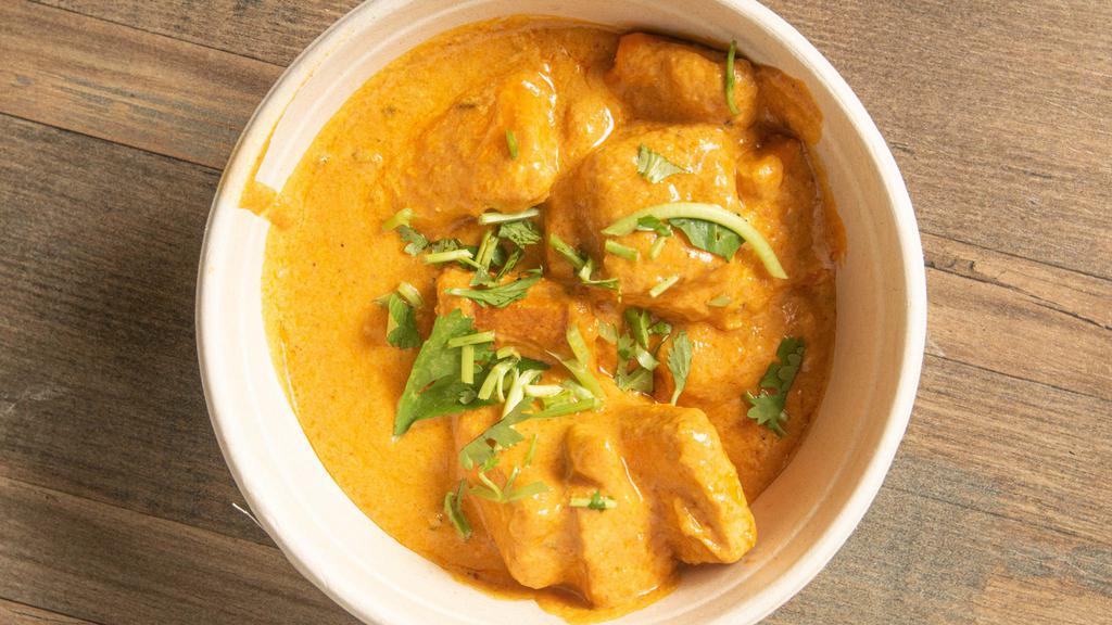Paneer Butter Masala · Cottage cheese cubes simmered in creamy onion and tomato gravy
