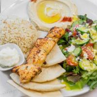 Chicken Kabob Plate · Grilled Chicken Kabob with a side of Rice, Hummus, Greek Salad & Pita Bread.