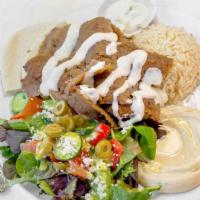 Gyro Plate · Lamb with a side of Rice, Hummus, Greek Salad & Pita Bread