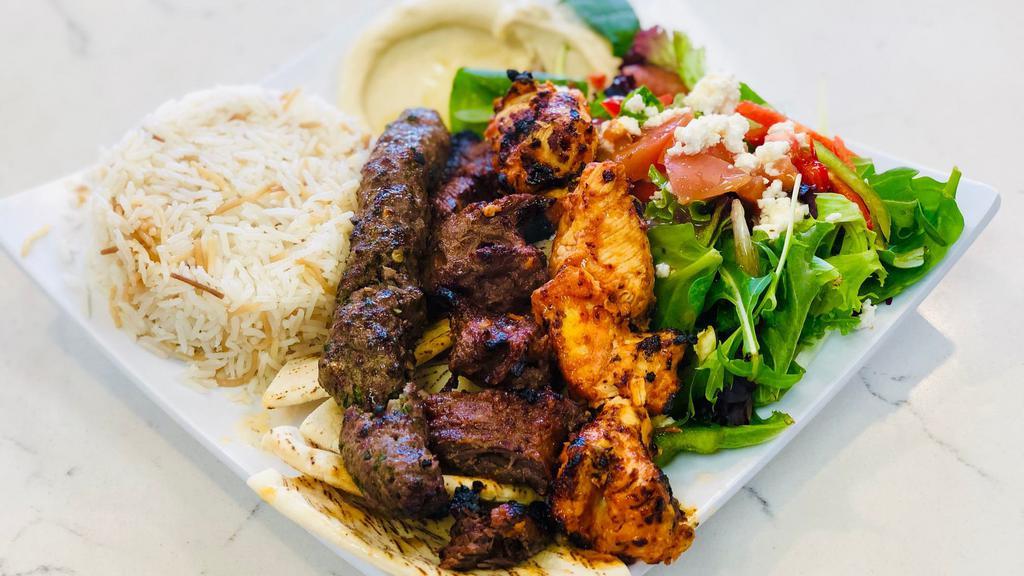 Chicken, Beef And Kefta Kabob Plate · Grilled Chicken Kabob, Beef & Kefta Kabob with a side of Rice, Hummus, Greek Salad & Pita Bread