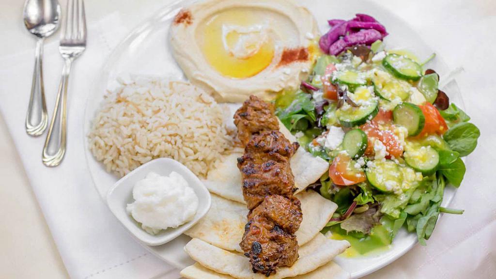 Beef Kabob Plate · Grilled Beef Kabob with a side of Rice, Hummus, Greek Salad & Pita Bread