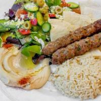 Kefta Kabob Plate · Ground Beef seasoned with Parsley and Onions with a side of Rice, Hummus, Greek Salad & Pita...