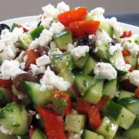 Greek Salad · Spring Mix Toped with Tomato, Cucumber, Bell Peppers, Feta Cheese, Olives and our Signature ...