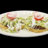 Sopes · Choice of meat includes lettuce and sour cream prepared on thick tortilla