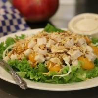 Mandarin Chicken Salad · Grilled chicken breast, greens, cabbage, noodles, almonds, mandarin oranges, and creamy Asia...