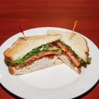 Club · Roast turkey and crisp bacon with lettuce, tomato served on your choice of toasted bread.