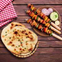 Chicken Tikka & Naan Bread  · A popular national dish of the UK, a rich creamy tomato-based curry with Naan BreadÂ