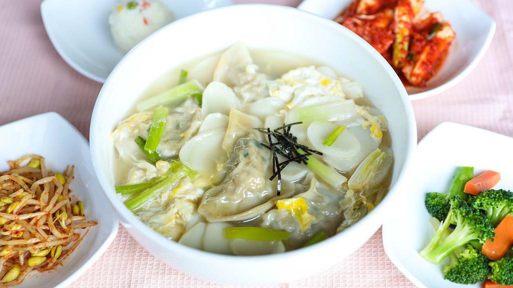Dduk Mandoo Guk · Homemade dumplings and rice cakes in beef broth.