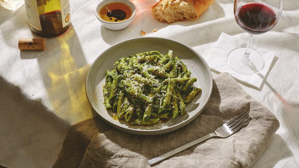 Penne Pesto · Penne pasta tossed in a savory pesto sauce and topped with fresh Parmesan cheese.