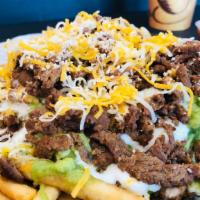 Carne Asada Fries · Fries cooked crispy , topped off with melted cheese, guacamole, sour cream, & Carne Asada!