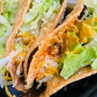 Crunchy Tacos · Served with lettuce and cheese.