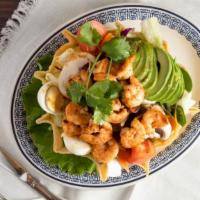 Seafood Chalupa Salad · Shrimp, crisp greens, mushrooms, avocado, bacon, hard boiled eggs, cheese, and mild jalapeño...