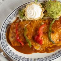 Fajita Burrito · Steak or chicken, grilled onion, peppers, and refried beans, flour tortilla, topped with red...