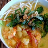 Seafood Curry Soup · Large prawns, mussels, krab and veggies in delicious coconut milk curry broth.