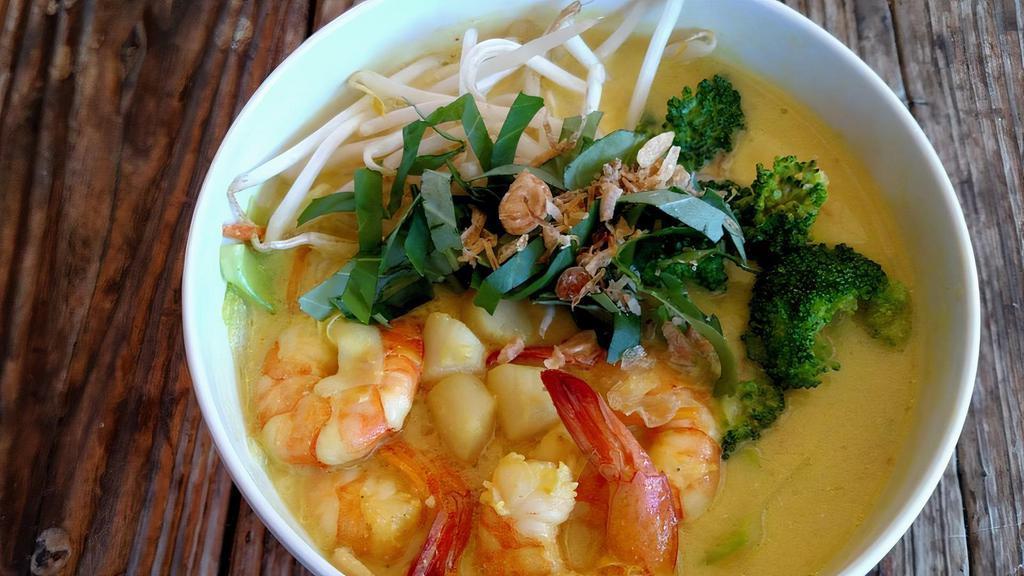 Seafood Curry Soup · Large prawns, mussels, krab and veggies in delicious coconut milk curry broth.
