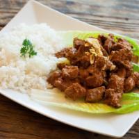 Rendang · Spicy beef stew with traditional Indonesian spices.