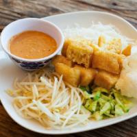 Ketoprak · Steamed vegetables, tofu and rice noodles served with our own spicy peanut sauce.