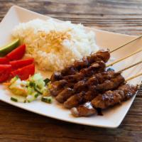 Lamb Satay (Sate Kambing) · Five skewers of tender lamb grilled and covered with ketcap manis and spicy sambal (on reque...