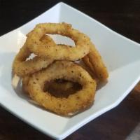 Spicy Calamari Tempura · Seasoned strips of calamari dipped in tempura batter and deep-fried served with our creamy w...