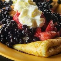 Crepes · 3 housemade crepes filled with lemon ricotta topped with strawberries or blueberries and whi...
