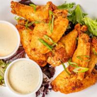 Sriracha Ranch Wings · Brined and fried, dusted in sriracha-ranch spice, with ranch and BBQ sauce.