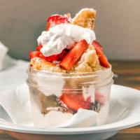 Mason Jar Shortcake · Sweet biscuit shortcake, sugared strawberries, layered with whip.