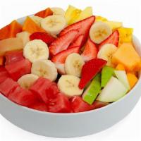 Ensalada De Fruta · Fruit salad with cream and granola. Fruit include red apples, bananas, pears, watermelon, me...