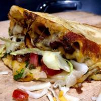 Mulita · Melted Mozzarella cheese sandwiched between two grilled hand-pressed tortillas. Includes, ci...