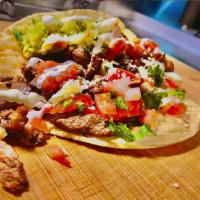Taco (Hand Press Tortilla) · Large hand-pressed tortilla. Includes cilantro, onions, tomato, sour cream, cotija cheese (T...